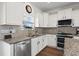 Spacious kitchen with granite countertops, stainless steel appliances, and white cabinets at 626 Notting Hill Ct., Conway, SC 29526