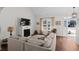 Bright living room with hardwood floors, fireplace and access to front entry at 626 Notting Hill Ct., Conway, SC 29526