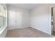 Spacious bedroom with window, double doors, and access to hallway at 643 Woodside Dr., Conway, SC 29526