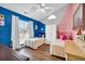 Shared bedroom features unique color-blocked walls, and hardwood floors at 6716 Wisteria Dr., Myrtle Beach, SC 29588