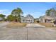 Charming single-Gathering home featuring a manicured front yard and a welcoming entrance at 6716 Wisteria Dr., Myrtle Beach, SC 29588
