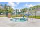 Community hot tub with safety rail is enclosed by a black metal fence with security and safety signage at 6716 Wisteria Dr., Myrtle Beach, SC 29588