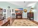 Cozy living room features a fireplace, hardwood floors, and stylish decor at 6716 Wisteria Dr., Myrtle Beach, SC 29588