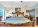 Bright and airy main bedroom with a queen size bed, wood furniture, and natural light at 6716 Wisteria Dr., Myrtle Beach, SC 29588