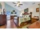 Spacious main bedroom featuring vaulted ceilings, a ceiling fan, and large windows at 6716 Wisteria Dr., Myrtle Beach, SC 29588