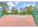 The pickle ball court features a net and red-and-blue court for the enjoyment of the residents at 6716 Wisteria Dr., Myrtle Beach, SC 29588