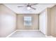 Bedroom featuring a window with blinds and double door closet at 677 Tupelo Ln. # 301, Longs, SC 29568