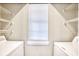 Bright laundry room with window, shelving and washer and dryer hookups at 677 Tupelo Ln. # 301, Longs, SC 29568