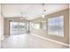 Living area featuring modern ceiling fans and sliding glass door to balcony at 677 Tupelo Ln. # 301, Longs, SC 29568