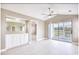 Open concept living room features large windows and doors with a golf course view at 677 Tupelo Ln. # 301, Longs, SC 29568