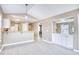 Open-concept space featuring breakfast bar connecting the kitchen and living room at 677 Tupelo Ln. # 301, Longs, SC 29568