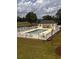 Outdoor pool with seating area surrounded by a white fence at 677 Tupelo Ln. # 301, Longs, SC 29568