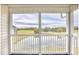 Covered porch view of pond and golf course at 677 Tupelo Ln. # 301, Longs, SC 29568