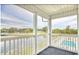 Spacious porch with views of lake, golf course, and pool at 677 Tupelo Ln. # 301, Longs, SC 29568