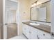 Bathroom features a vanity with granite countertop at 7602 Porcher Dr. # C, Myrtle Beach, SC 29572