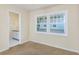 Bedroom with window and view of a neighboring house at 7602 Porcher Dr. # C, Myrtle Beach, SC 29572