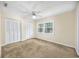 Spacious bedroom with ceiling fan, carpet, and double closets at 7602 Porcher Dr. # C, Myrtle Beach, SC 29572