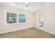 Cozy bedroom with carpet, ceiling fan, and en-suite bathroom at 7602 Porcher Dr. # C, Myrtle Beach, SC 29572
