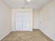 Bedroom with double door closet and neutral carpet at 7602 Porcher Dr. # C, Myrtle Beach, SC 29572