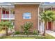 Sandwood Square building exterior, showcasing the brick facade and landscaping at 7602 Porcher Dr. # C, Myrtle Beach, SC 29572