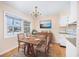 Charming dining area with wood table, hardwood floors, and kitchen access at 7602 Porcher Dr. # C, Myrtle Beach, SC 29572