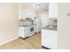 Bright kitchen, white cabinets, and view into dining area at 7602 Porcher Dr. # C, Myrtle Beach, SC 29572