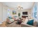 Living room with neutral decor, hardwood floors, and a large TV at 7602 Porcher Dr. # C, Myrtle Beach, SC 29572