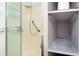 Small shower stall with glass door and built-in shelving at 804 Geddings Dr., Myrtle Beach, SC 29588