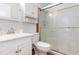 Bright bathroom featuring a shower, toilet and vanity with storage at 804 Geddings Dr., Myrtle Beach, SC 29588
