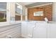 Walk-in bathtub with brick feature wall at 804 Geddings Dr., Myrtle Beach, SC 29588