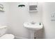Small bathroom with pedestal sink and white toilet at 804 Geddings Dr., Myrtle Beach, SC 29588