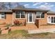 Brick ranch house with a spacious front yard and landscaped flowerbeds at 804 Geddings Dr., Myrtle Beach, SC 29588