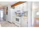 White kitchen cabinets and appliances, including a microwave and oven at 804 Geddings Dr., Myrtle Beach, SC 29588