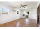 Sunroom with hardwood floors, ceiling fan, and brick accent wall at 804 Geddings Dr., Myrtle Beach, SC 29588