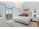 Bright main bedroom with a king-size bed and private balcony access at 8500 Margate Circle # 109, Myrtle Beach, SC 29572