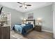 Cozy bedroom with a ceiling fan and wood flooring at 1009 World Tour Blvd. # 304, Myrtle Beach, SC 29579