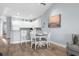 Charming dining area with white table and chairs, adjacent to the kitchen at 1009 World Tour Blvd. # 304, Myrtle Beach, SC 29579