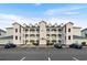 Three-story building with parking lot and landscaping at 1009 World Tour Blvd. # 304, Myrtle Beach, SC 29579