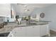 Kitchen boasts granite counters, white cabinets, and breakfast bar at 1009 World Tour Blvd. # 304, Myrtle Beach, SC 29579