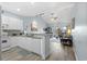 Open kitchen with white cabinets, granite counters, and stainless steel appliances at 1009 World Tour Blvd. # 304, Myrtle Beach, SC 29579