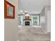 Spacious living room featuring a fireplace and large windows offering natural light at 102 Berry Tree Ln., Conway, SC 29526