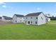 Two-story house with gray siding, large backyard, and patio at 1032 Kinness Dr., Conway, SC 29527
