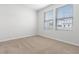 Spacious bedroom with neutral walls, carpet flooring, and two windows at 1032 Kinness Dr., Conway, SC 29527