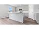 Modern kitchen with gray cabinets, white countertops, and island at 1032 Kinness Dr., Conway, SC 29527