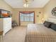 Bright bedroom with a ceiling fan, window, and a cozy neutral color palette at 1109 Peace Pipe Ln. # 201, Myrtle Beach, SC 29579