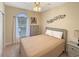 Cozy bedroom features a ceiling fan, neutral decor, natural light, and serene ambiance at 1109 Peace Pipe Ln. # 201, Myrtle Beach, SC 29579
