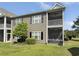 Condo featuring two stories with a screened porch overlooking a grassy lawn at 1109 Peace Pipe Ln. # 201, Myrtle Beach, SC 29579