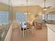 Open-concept living area with vaulted ceilings, dining space, and comfortable seating at 1109 Peace Pipe Ln. # 201, Myrtle Beach, SC 29579