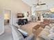 Cozy living room with vaulted ceilings, comfortable sofas, and a view into the dining area at 1109 Peace Pipe Ln. # 201, Myrtle Beach, SC 29579