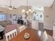 Spacious living room featuring vaulted ceilings and open layout to kitchen and dining area at 1109 Peace Pipe Ln. # 201, Myrtle Beach, SC 29579